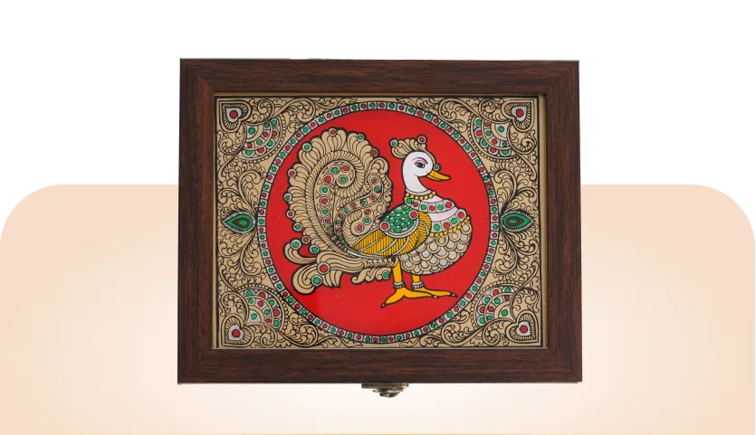Tanjore Art Trays: a hardwood tray whose lid holds a hand-painted Tanjore peacock panel in gold relief on a red ground.